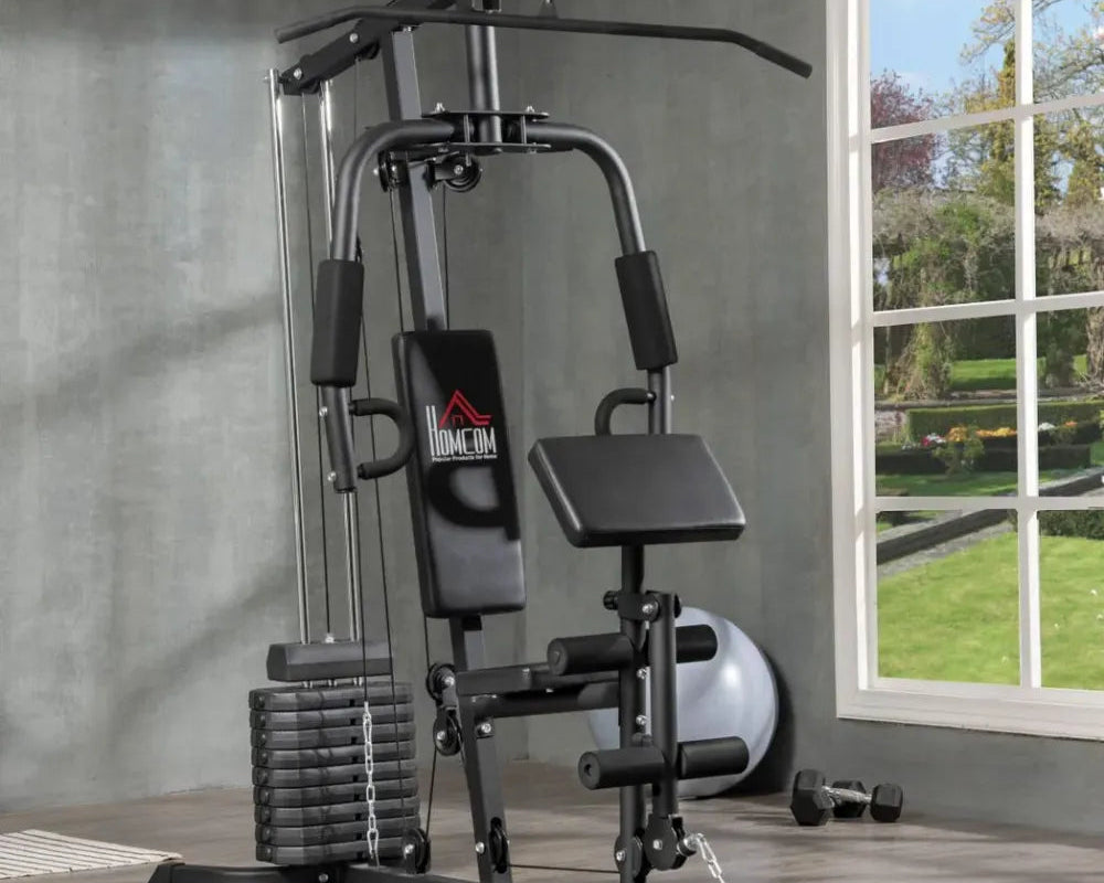 Home gym equipment with a brand logo in a room with a window showing greenery.